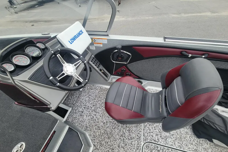 Slide: The Image of 2018 Ranger 2080MS Angler boat interior with steering wheel, Lowrance device, and cushioned seat. - 9