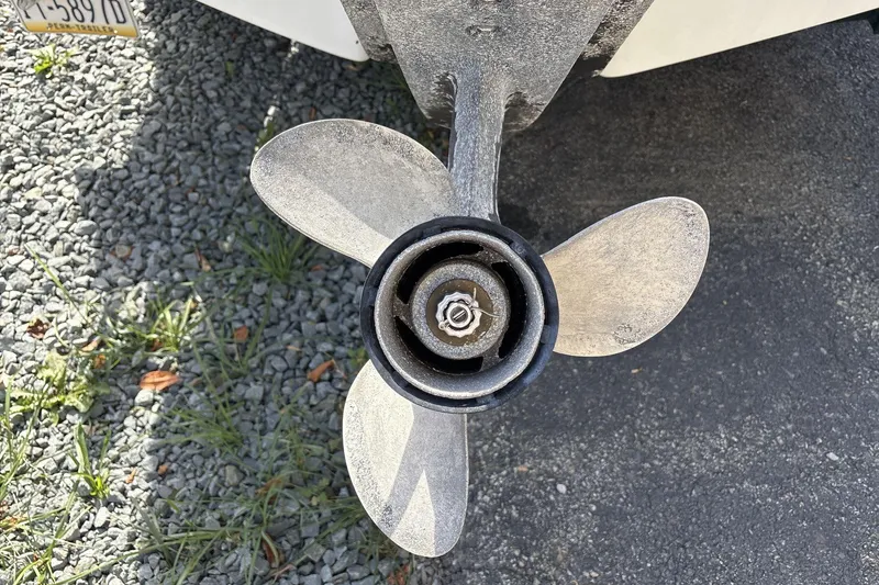 Slide: The Image of Propeller of 2001 Four Winns 180 Horizon boat on gravel surface. - 4