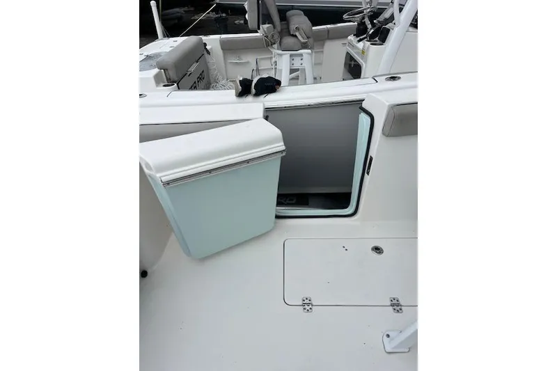 Slide: The Image of 2019 Sea Pro 259 Center Console boat interior with open storage compartment. - 10