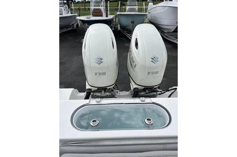 Slide: The Image of Twin Suzuki 175 outboard engines on a 2019 Sea Pro 259 Center Console boat. - 11