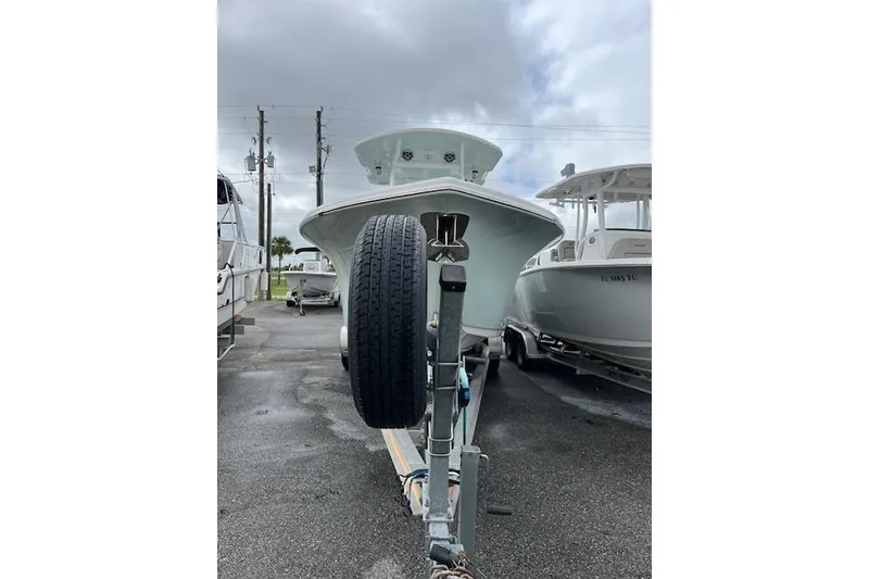 Slide: The Image of 2019 Sea Pro 259 Center Console boat on trailer, parked outdoors. - 13