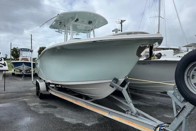 Slide: The Image of 2019 Sea Pro 259 Center Console boat on trailer, parked outdoors. - 15