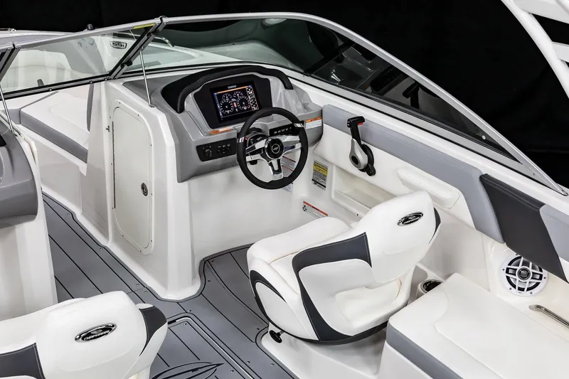Slide: The Image of Manufacturer Provided Image: 2025 Chaparral 23 SSi OB boat interior with white and gray seating, sleek design. - 2