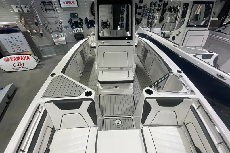 Slide: The Image of 2025 Yamaha Boats 255 FSH Sport H interior with sleek seating and modern design. - 10
