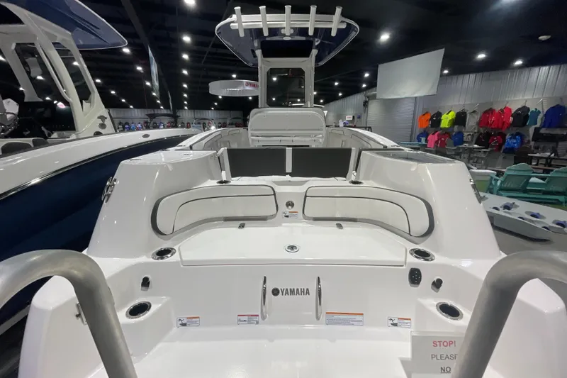 Slide: The Image of 2025 Yamaha Boats 255 FSH Sport H interior, showcasing sleek design and seating arrangement. - 4
