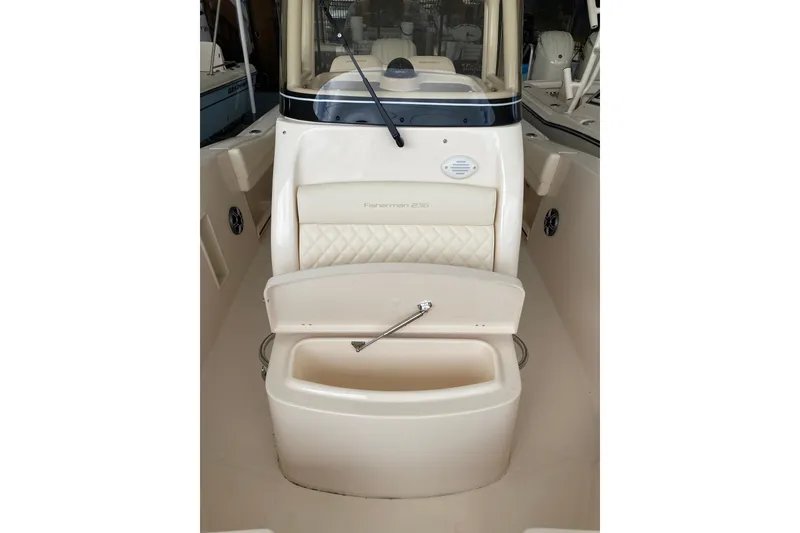 Slide: The Image of 2026 Grady-White Fisherman 236 boat interior with seating and storage compartment. - 11