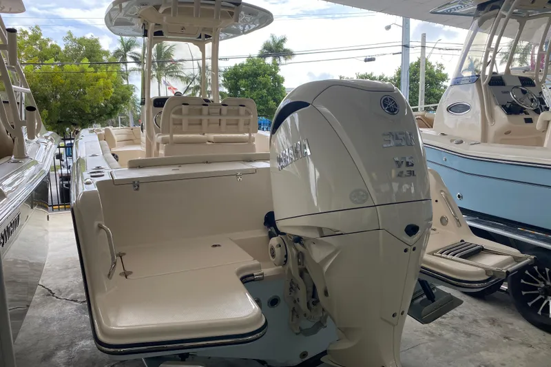 Slide: The Image of 2026 Grady-White Fisherman 236 boat with Yamaha V6 engine, docked outdoors. - 18