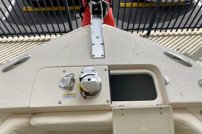 Slide: The Image of 2026 Grady-White Fisherman 236 boat deck with anchor storage and winch system. - 4
