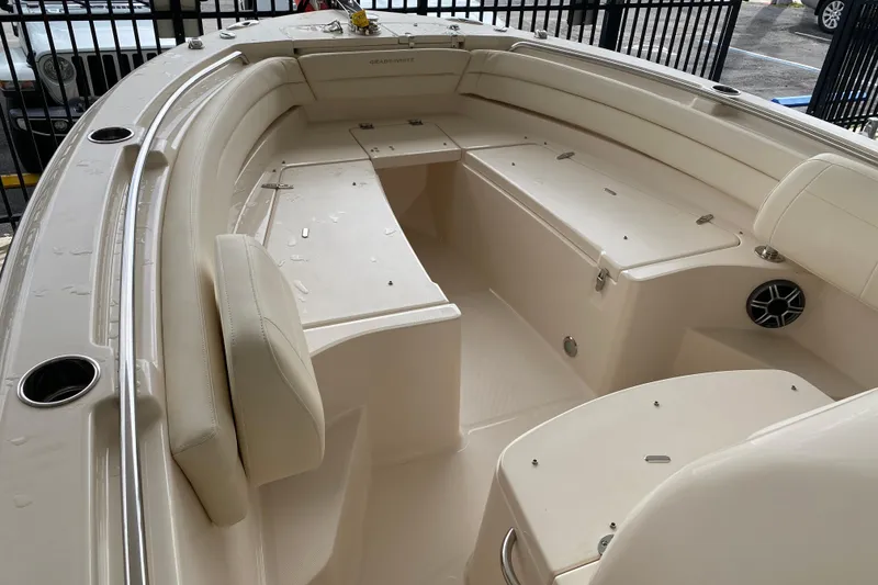 Slide: The Image of 2026 Grady-White Fisherman 236 boat interior with seating and storage compartments. - 5