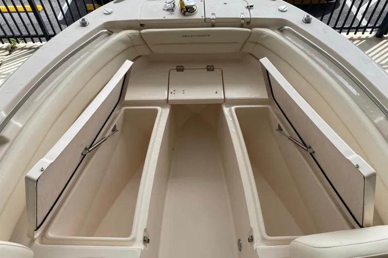 Slide: The Image of 2026 Grady-White Fisherman 236 boat interior with open storage compartments. - 7