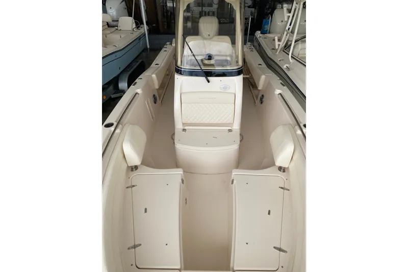 Slide: The Image of 2026 Grady-White Fisherman 236 boat interior with seating and storage compartments. - 8