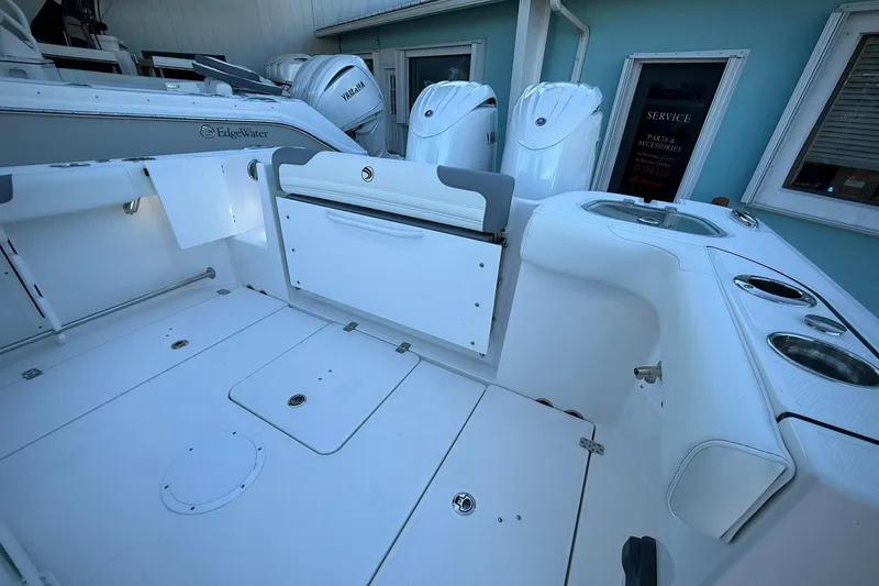 Slide: The Image of Edgewater 250CC 2026 boat interior with Yamaha engines, featuring spacious deck and storage compartments. - 15