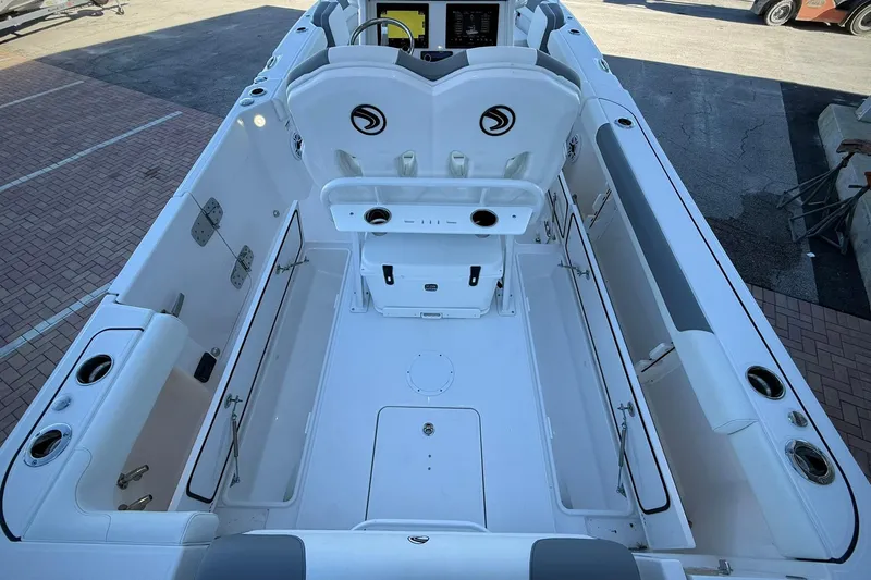 Slide: The Image of 2026 Edgewater 250CC boat interior with seating and storage compartments, viewed from above. - 17