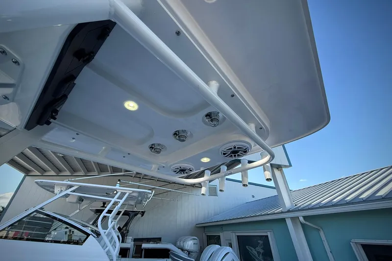 Slide: The Image of 2026 Edgewater 250CC boat with speakers and lights on the overhead console. - 25