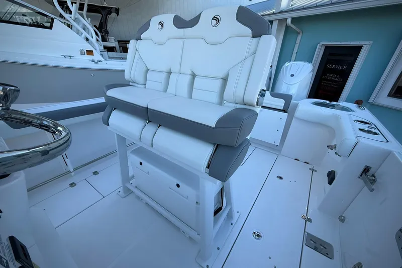 Slide: The Image of 2026 Edgewater 250CC boat interior with white and gray seating, modern design. - 27