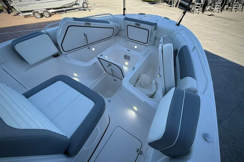 Slide: The Image of 2026 Edgewater 250CC boat interior with seating and storage compartments. - 35