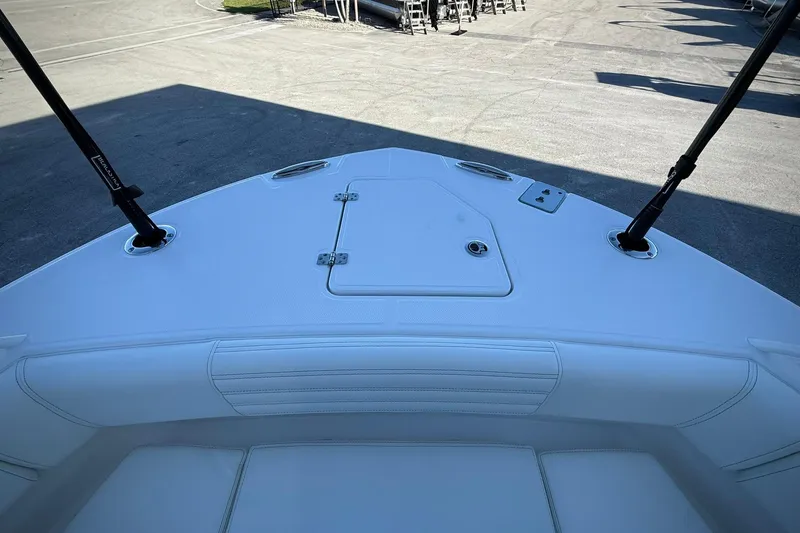 Slide: The Image of 2026 Edgewater 250CC boat deck, featuring sleek design and storage compartments. - 36