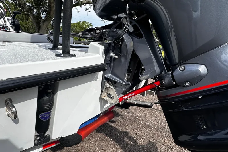 Slide: The Image of 2022 Maverick 17 HPX-V boat motor and transom detail, featuring a red support bar. - 11