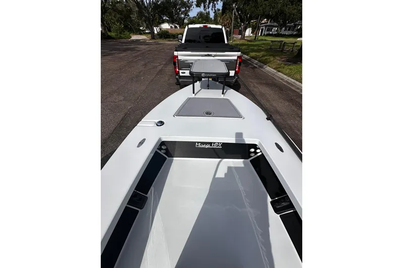 Slide: The Image of 2022 Maverick 17 HPX-V boat hitched to a truck on a residential street. - 22