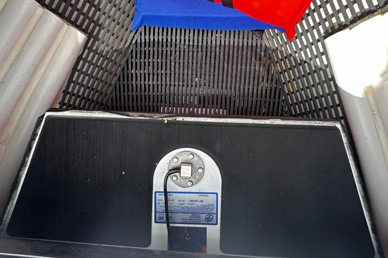 Slide: The Image of 2022 Maverick 17 HPX-V boat interior with storage compartment and safety equipment. - 24