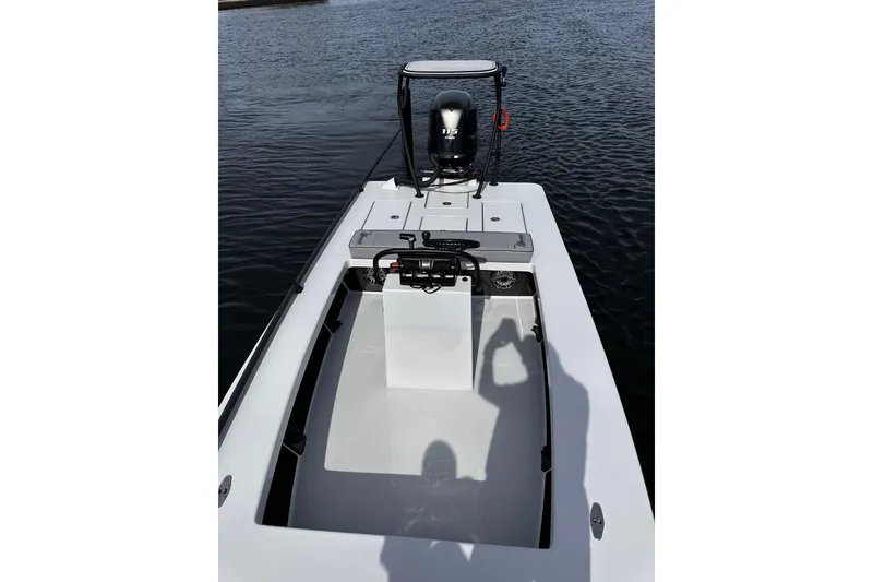 Slide: The Image of 2022 Maverick 17 HPX-V boat on water, showcasing sleek design and powerful engine. - 31