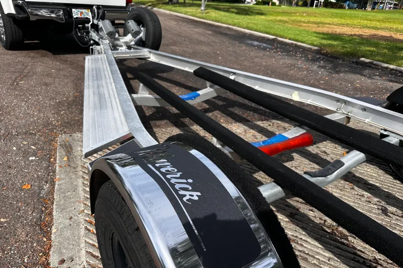 Slide: The Image of Trailer for 2022 Maverick 17 HPX-V boat, parked on a sunny street. - 33