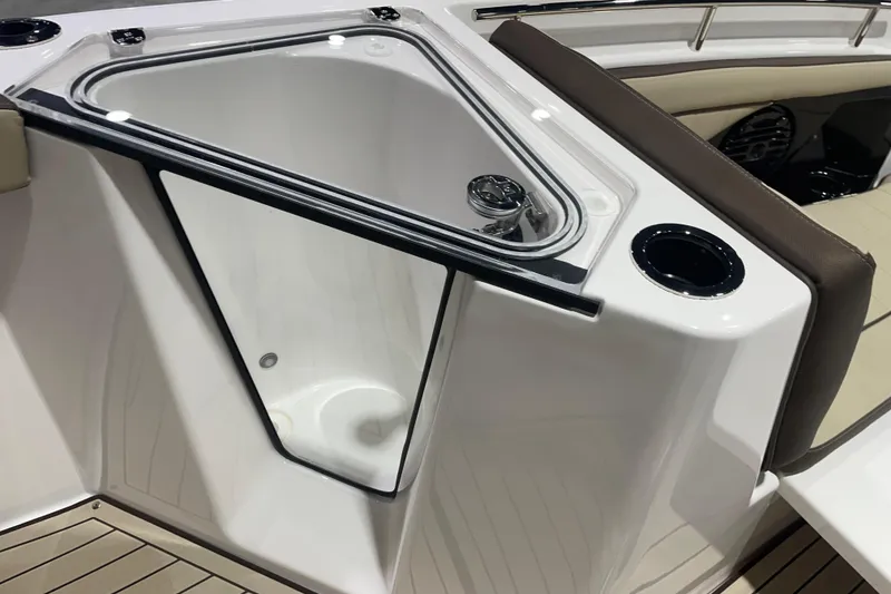 Slide: The Image of Yamaha Boats 2025 252 FSH Sport interior detail with storage compartment and seating. - 11