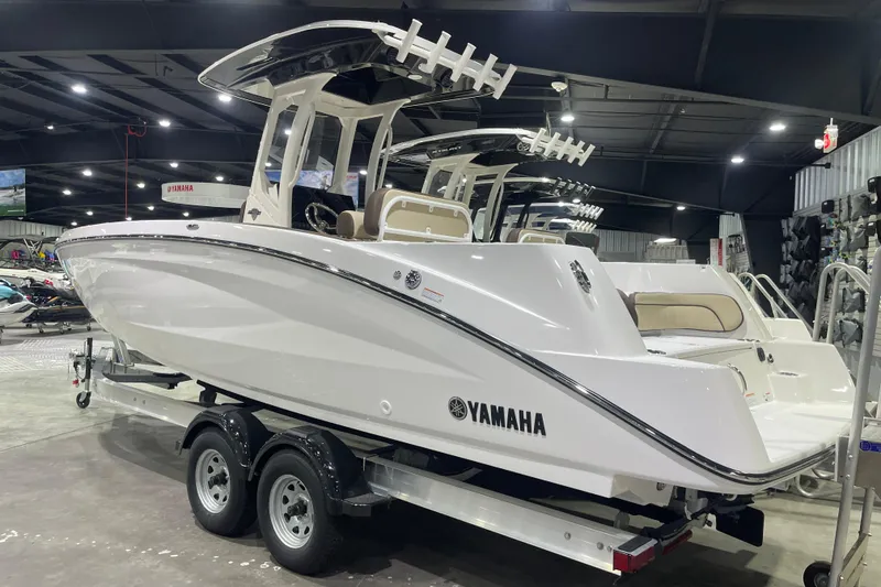 Slide: The Image of 2025 Yamaha Boats 252 FSH Sport displayed indoors on a trailer. - 3