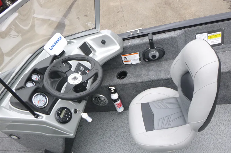 Slide: The Image of 2019 Tracker Pro Guide V-175 Combo boat cockpit with steering wheel and seat. - 12