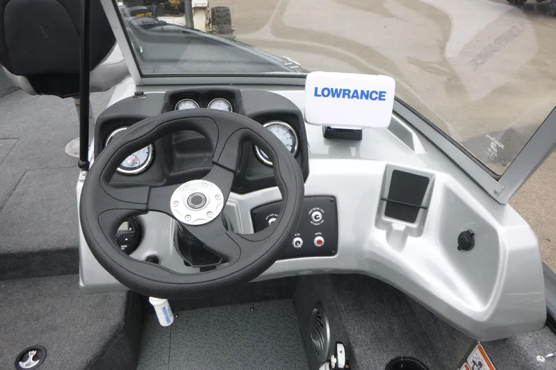 Slide: The Image of 2019 Tracker Pro Guide V-175 Combo boat dashboard with steering wheel and Lowrance display. - 13