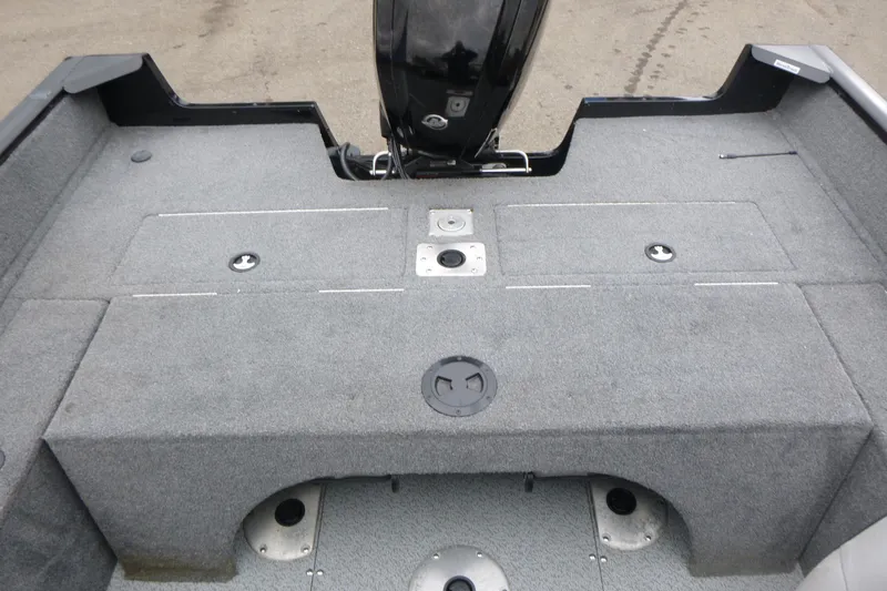 Slide: The Image of 2019 Tracker Pro Guide V-175 Combo boat interior with carpeted deck and motor. - 15