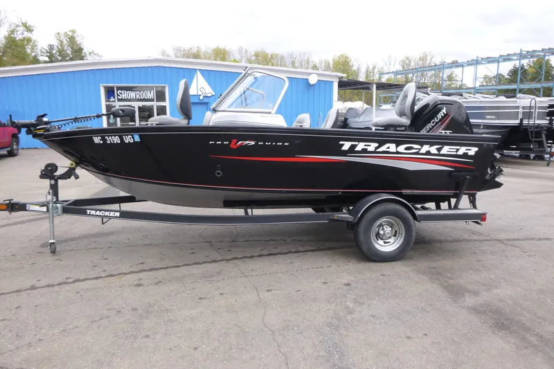 Slide: The Image of 2019 Tracker Pro Guide V-175 Combo boat on trailer, parked outside showroom. - 4