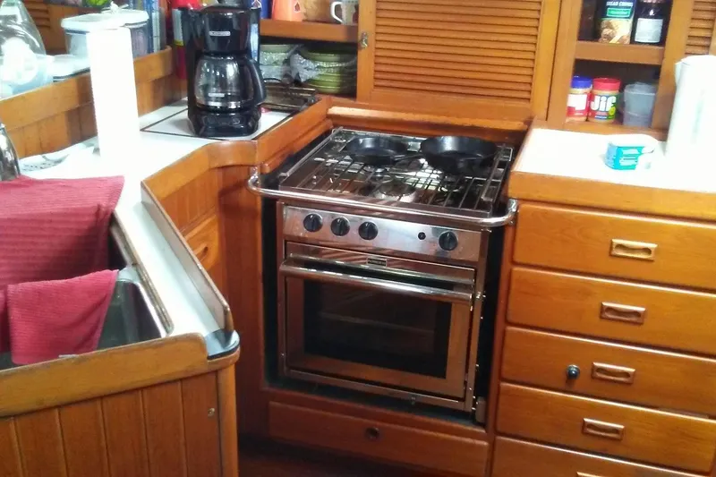 Slide: The Image of Galley kitchen in 1988 Tayana Vancouver 42 sailboat with stove and coffee maker. - 15