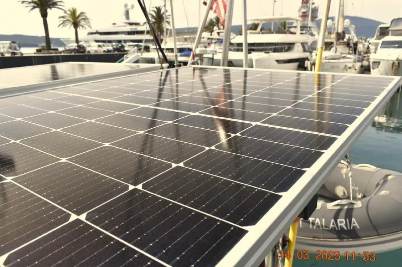 Slide: The Image of Solar panels on a 1988 Tayana Vancouver 42 yacht in a marina setting. - 21