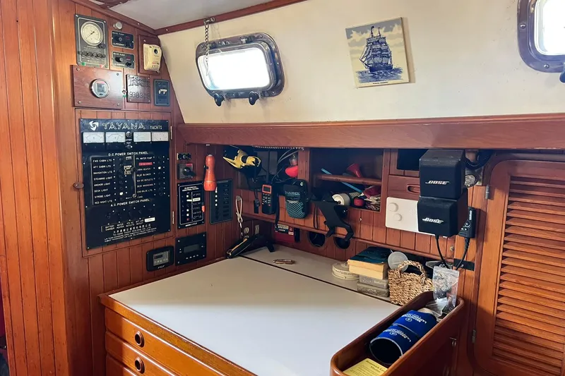 Slide: The Image of Interior of a 1988 Tayana Vancouver 42 with red bedding. - 33