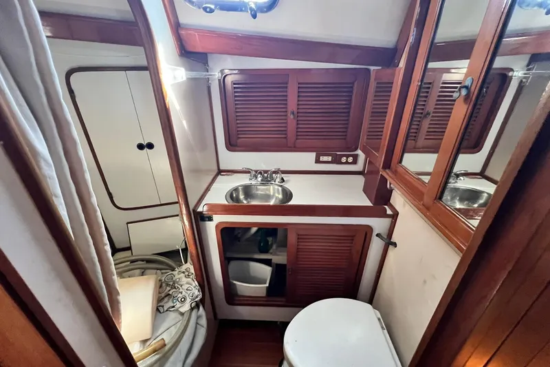 Slide: The Image of Interior of a 1988 Tayana Vancouver 42 yacht with wooden furnishings. - 40