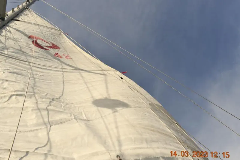 Slide: The Image of Sail of 1988 Tayana Vancouver 42 yacht against a clear blue sky. - 5