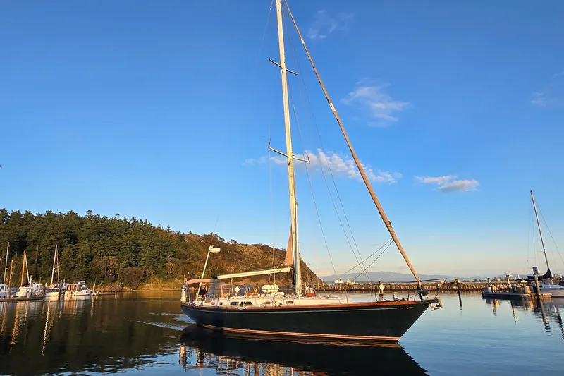 The Image of Sailboat Cambria 46 from 1986 on calm water, with scenic background. - 0