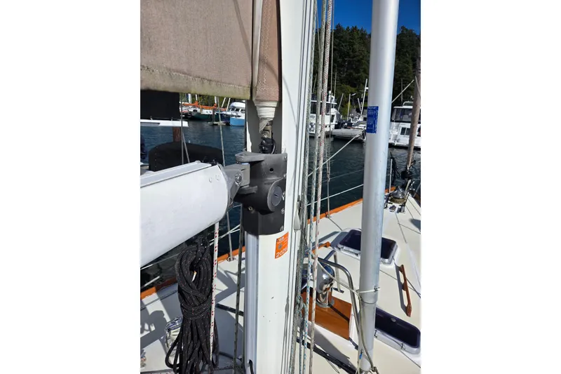 Slide: The Image of Sailboat mast and rigging on 1986 Cambria 46, docked in a marina. - 12