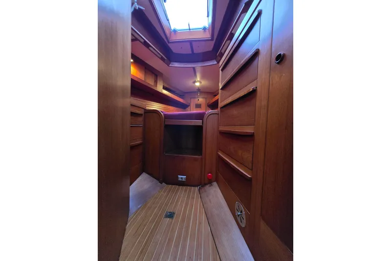 Slide: The Image of Interior of 1986 Cambria 46 sailboat with wooden cabinetry and skylight. - 20