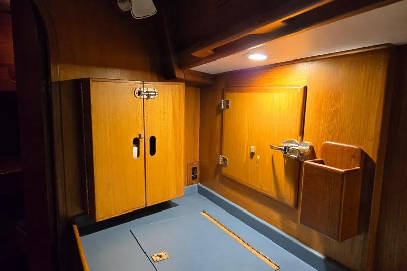 Slide: The Image of Wooden cabinetry and countertop in a 1986 Cambria 46 yacht interior. - 34