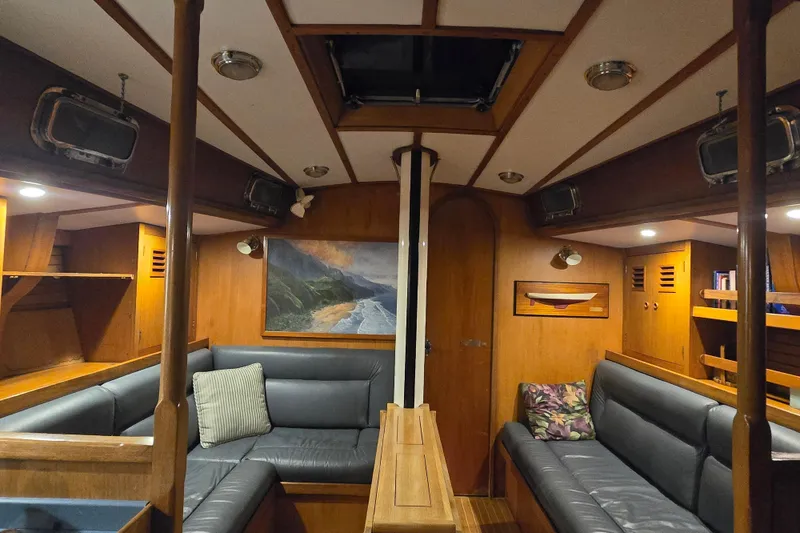 Slide: The Image of Interior of 1986 Cambria 46 yacht with cozy seating and wooden accents. - 37