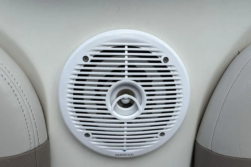 Slide: The Image of Kenwood speaker on 2002 Regal 2400 Bowrider boat interior. - 13