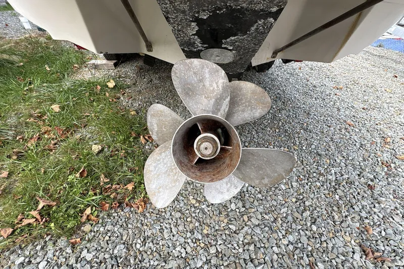 Slide: The Image of Propeller of 2002 Regal 2400 Bowrider on gravel and grass surface. - 4