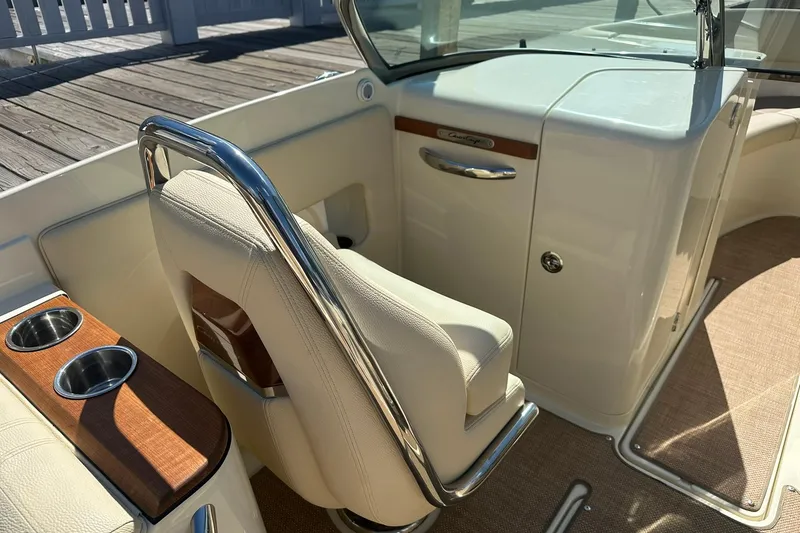 Slide: The Image of 2018 Chris-Craft Launch 27 interior with elegant seating and polished metal accents. - 10