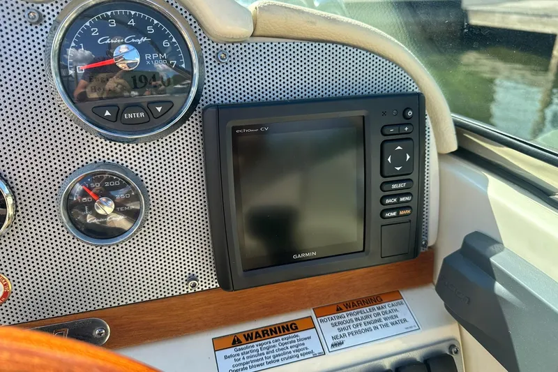 Slide: The Image of Dashboard of a 2018 Chris-Craft Launch 27 with Garmin display and gauges. - 13