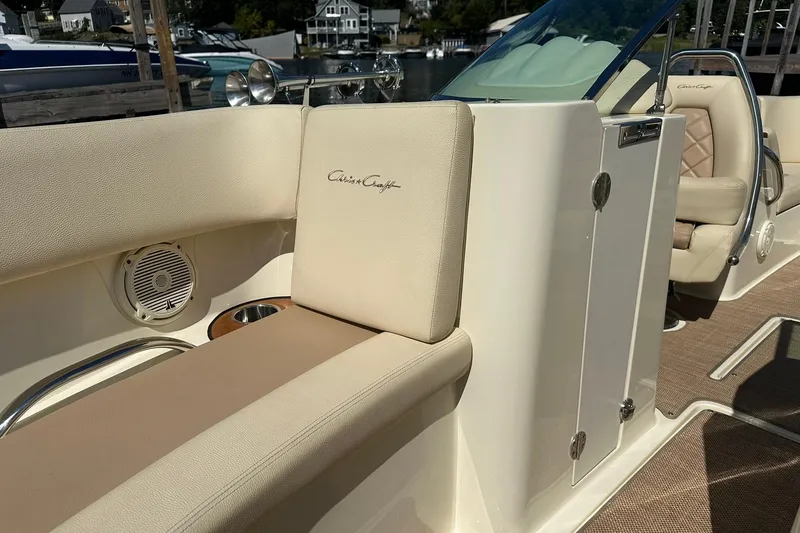 Slide: The Image of 2018 Chris-Craft Launch 27 interior with beige seating and elegant design. - 18