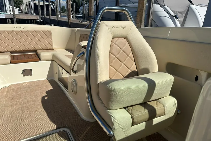 Slide: The Image of 2018 Chris-Craft Launch 27 boat interior with beige leather seating and elegant design. - 20