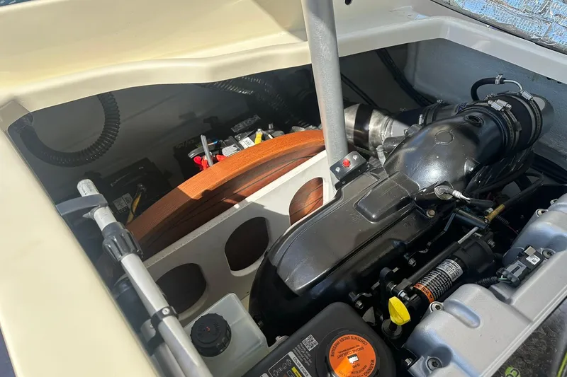 Slide: The Image of Engine compartment of a 2018 Chris-Craft Launch 27 boat, showcasing mechanical components. - 24