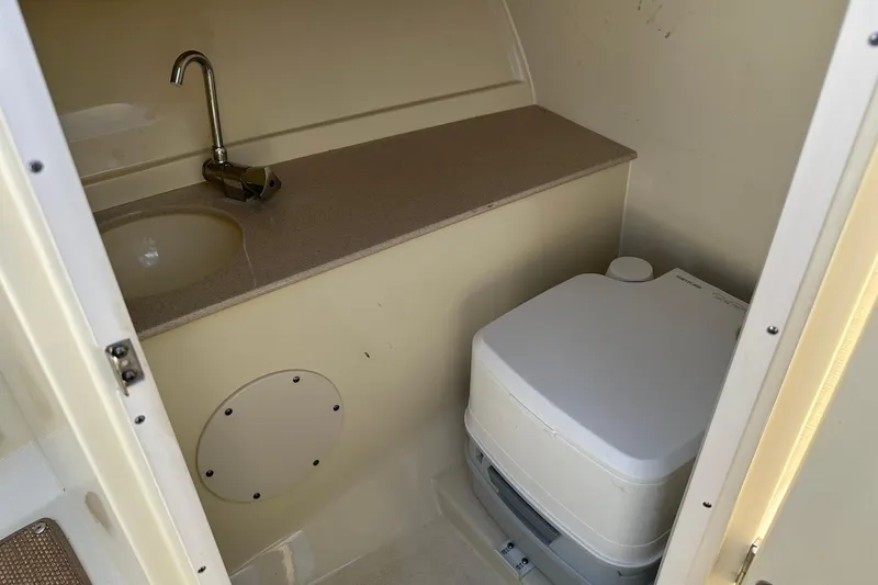 Slide: The Image of 2018 Chris-Craft Launch 27 boat interior with sink and portable toilet. - 26